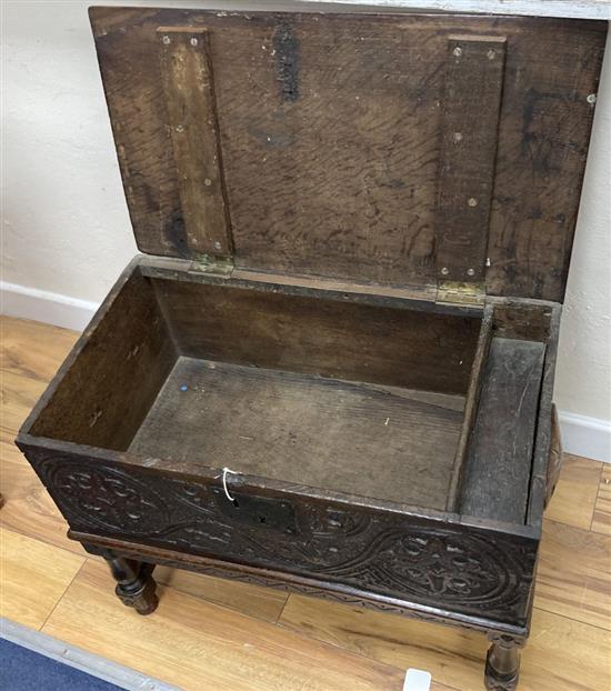 An 18th century oak bible box on associated stand, width 62cm, depth 34cm, height 49cm